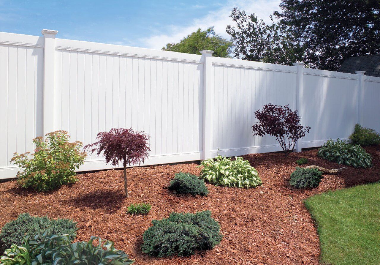 White vinyl privacy fence installed by Duck Duck Fence